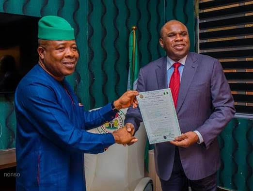 Afreximbank President Prof. Benedict Oramah (right) receiving certificate of occupancy for land for quality assurance centre from Imo State Governor Emeka Ihedioha in Owerri.