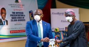 R-L: Babajide Sanwo-Olu, Lagos State Governor being presented with the Roducate e-learning device by Dr. Adesola Adeduntan, CEO, FirstBank to kick off the distribution of the preloaded Roducate e-learning devices to schoolchildren across the state in furtherance to the Bank’s drive to move 1 million students to e-learning.