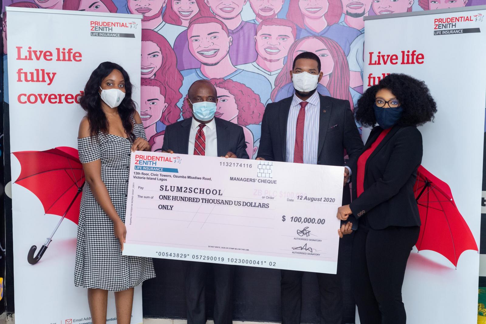 L-R: Head of Operation, Slum2School Innovation Hub, Dr. Ruth Ebe; MD/CEO, Prudential Zenith Life Insurance, Mr. Chuks Igumbor; Executive Director/Founder, Slum2School Innovation Hub, Mr. Otto Orondaam and Chief Commercial Officer, Prudential Zenith Life Insurance, Mrs. Isioma Olowu during the cheque presentation of $100,000USD donation to support Slum2School efforts at bridging the education gap amongst the less privileged students during this COVID-19 pandemic.