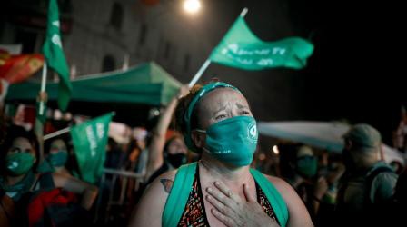 An abortion-rights activist reacts after lawmakers approved the bill.