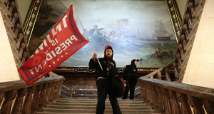 Trump supporter waves flag inside the Capitol Hill