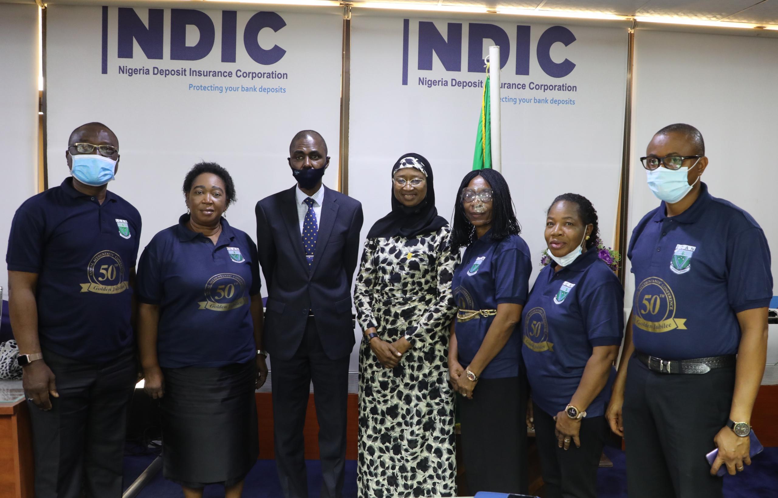 Pix 2: NDIC MD/CEO, Bello Hassan (3rd left) in a group photograph with ICAN Council Member, Sofura Seghosime (4th left), Abuja District Chairman, Bosede Ikanoba (2nd left) and other members during a courtesy visit to the MD/CE in Abuja.