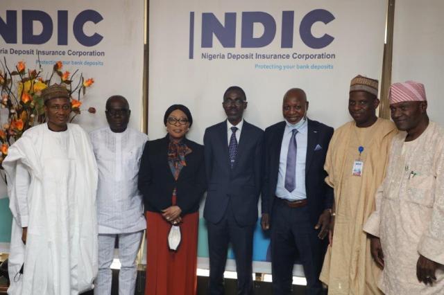 Managing Director/Chief Executive, Nigeria Deposit Insurance Corporation (NDIC) Bello Hassan (centre) poses for a group photograph with the President Nigerian Guild of Editors (NGE) Mustapha Isah (3rd right) during a courtesy call by the Guild to the Executive Management of the NDIC in Abuja. They are flanked by (L –R) NDIC Executive Director Operations, Mustapha M. Ibrahim, NGE General Secretary Iyobosa Uwugiaren, NDIC Executive Director Corporate Services Hon. Mrs. Omolola Abiola-Edewor, NGE Deputy President, Ali M. Ali and NGE Member Standing Committee, Gbenga Adeshina.