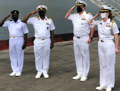 Nigerian Navy officers (left) receiving their U.S. Navy counterparts during the arrival of USS Hershel “Woody” Williams in Lagos on Saturday.