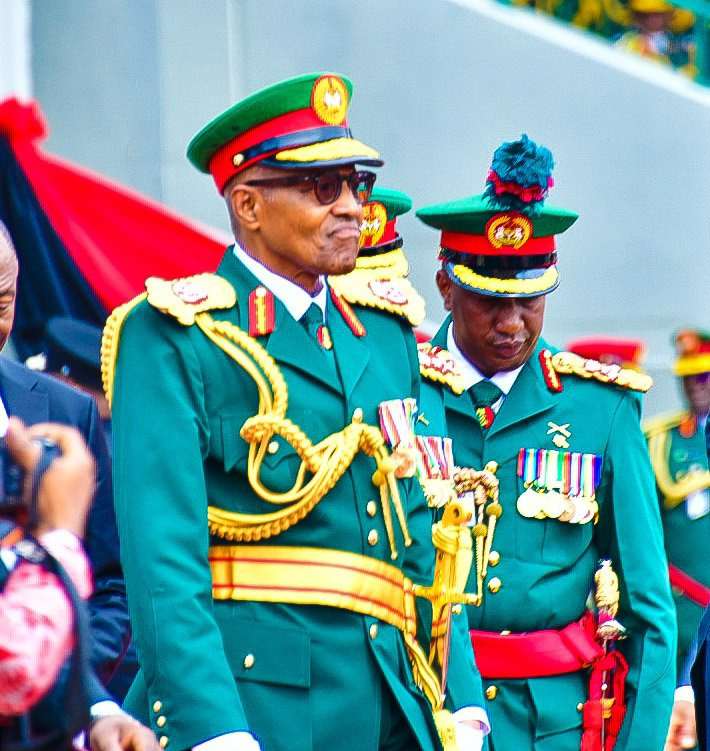 Buhari arrives army parade in military outfit