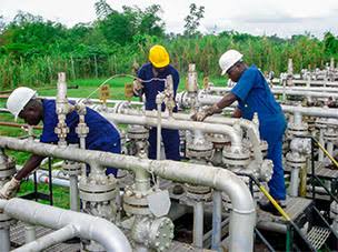 Workers at a gas plant in Delta