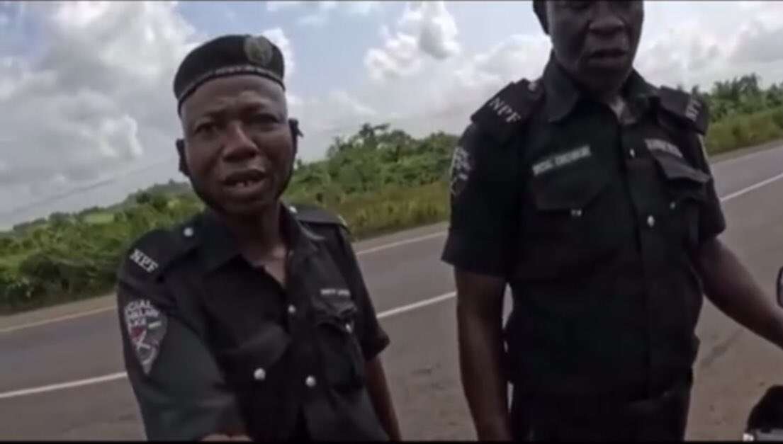 Police arrest officers filmed demanding money from foreign biker