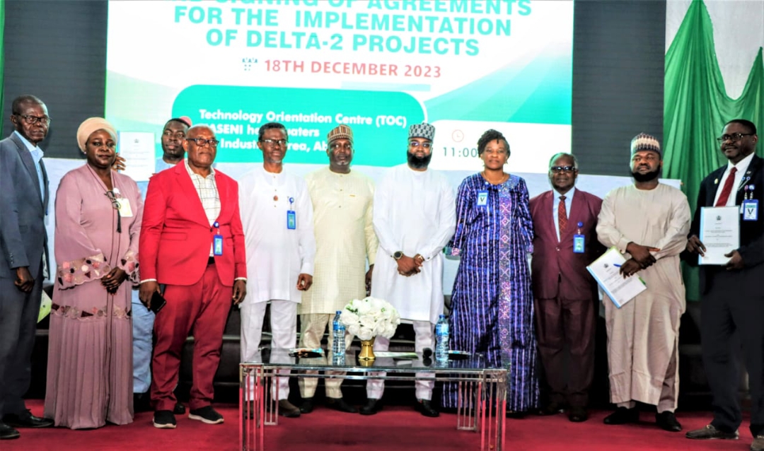 The Executive Vice Chairman and Chief Executive Officer of National Agency for Science and Engineering Infrastructure (NASENI), Mr. Khalil Suleiman Halilu (5th-right); Chairman, Presidential Implementation Committee on Technology Transfer and Information Exchange, Dr. Mohammed Dahiru (6th-right) and beneficiaries of the Delta-2 projects after the signing of implementation agreements at NASENI headquarters in Abuja on Monday