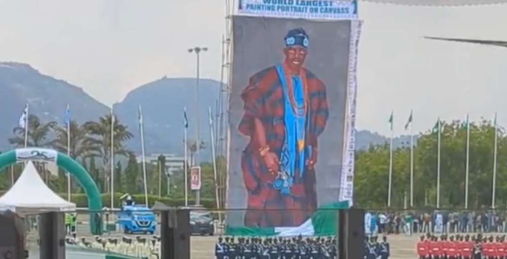 National Troupe unveils world largest canvass painting portrait of Tinubu