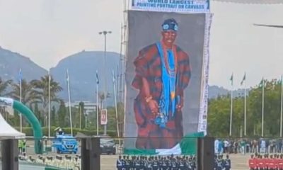 National Troupe unveils world largest canvass painting portrait of Tinubu
