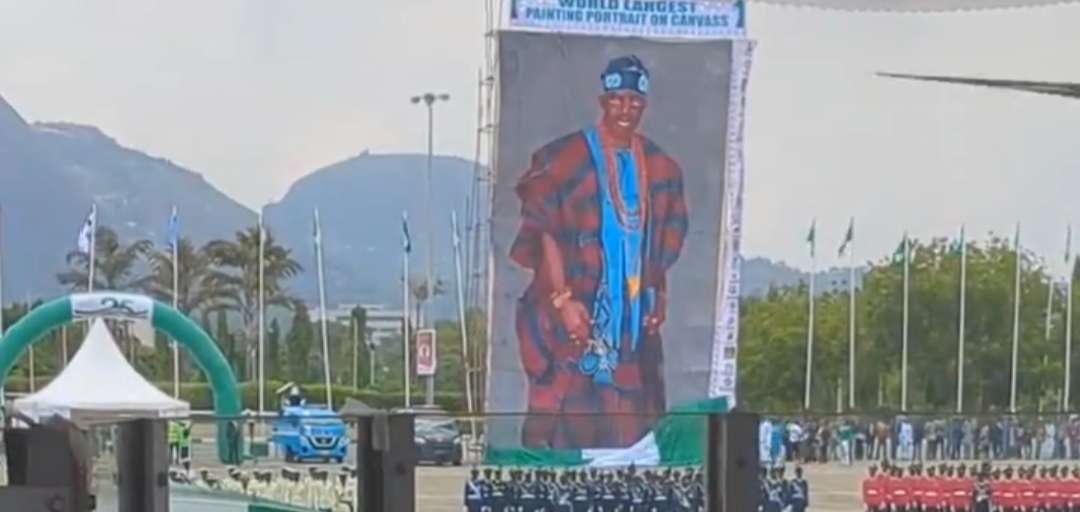 National Troupe unveils world largest canvass painting portrait of Tinubu