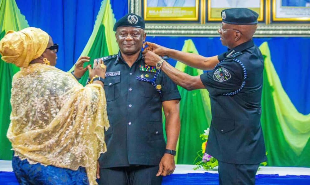 Egbetokun decorates Disu with AIG Rank