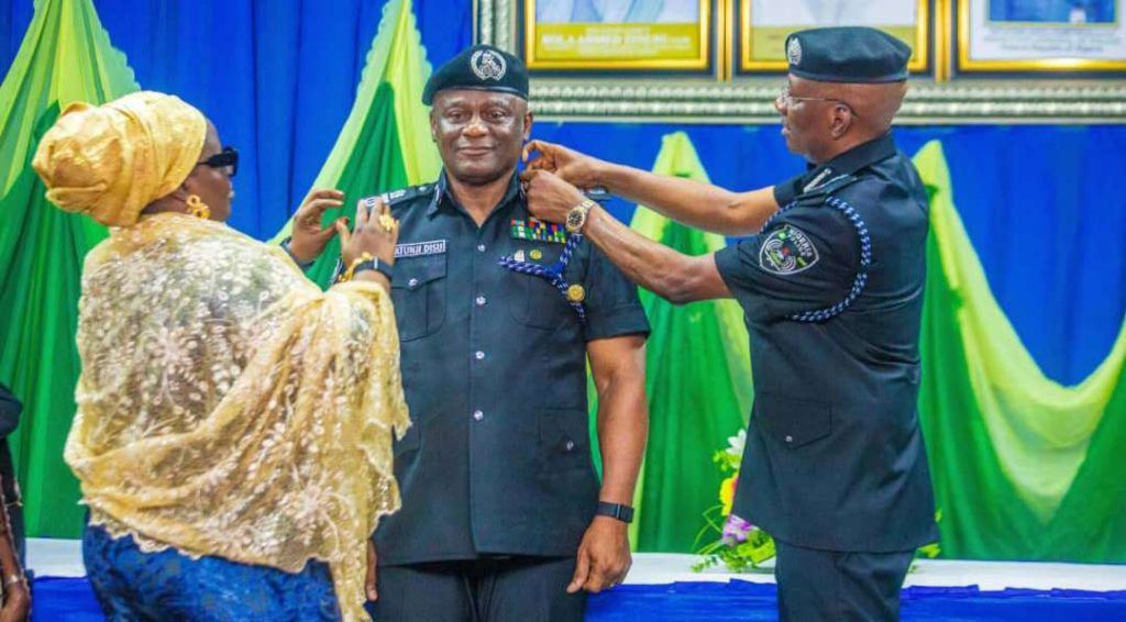 Egbetokun decorates Disu with AIG Rank