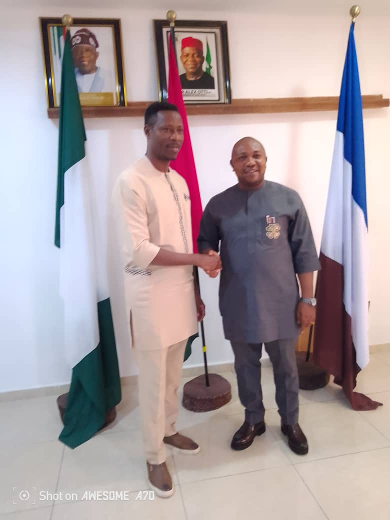 Steve Oko ( left) poses for pic with Rector Okoro ( right)