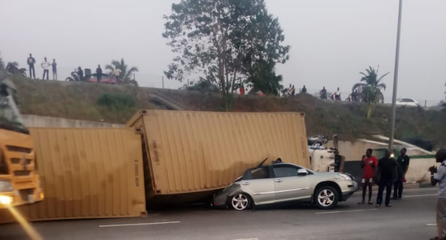 Man dies, wife injured as truck topples onto car in Lagos